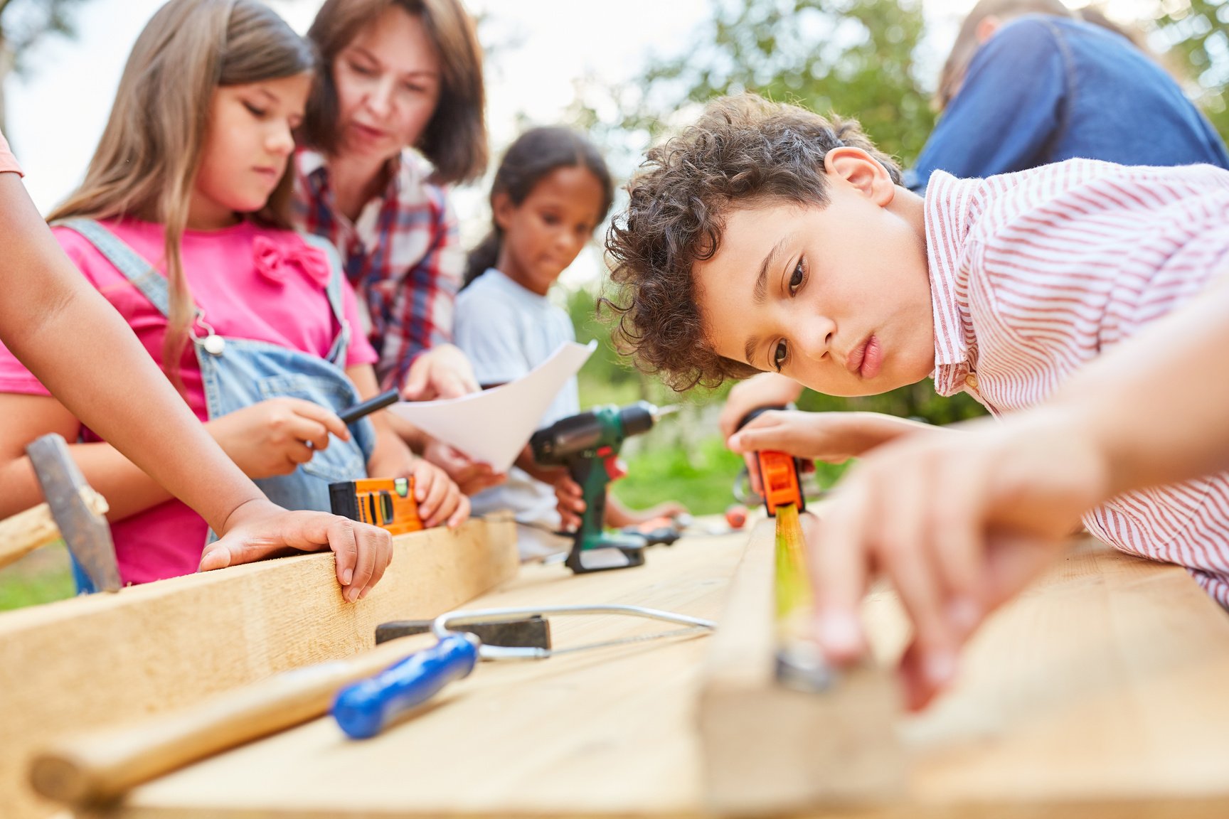 Children Do Handicrafts and Work Together with Wood