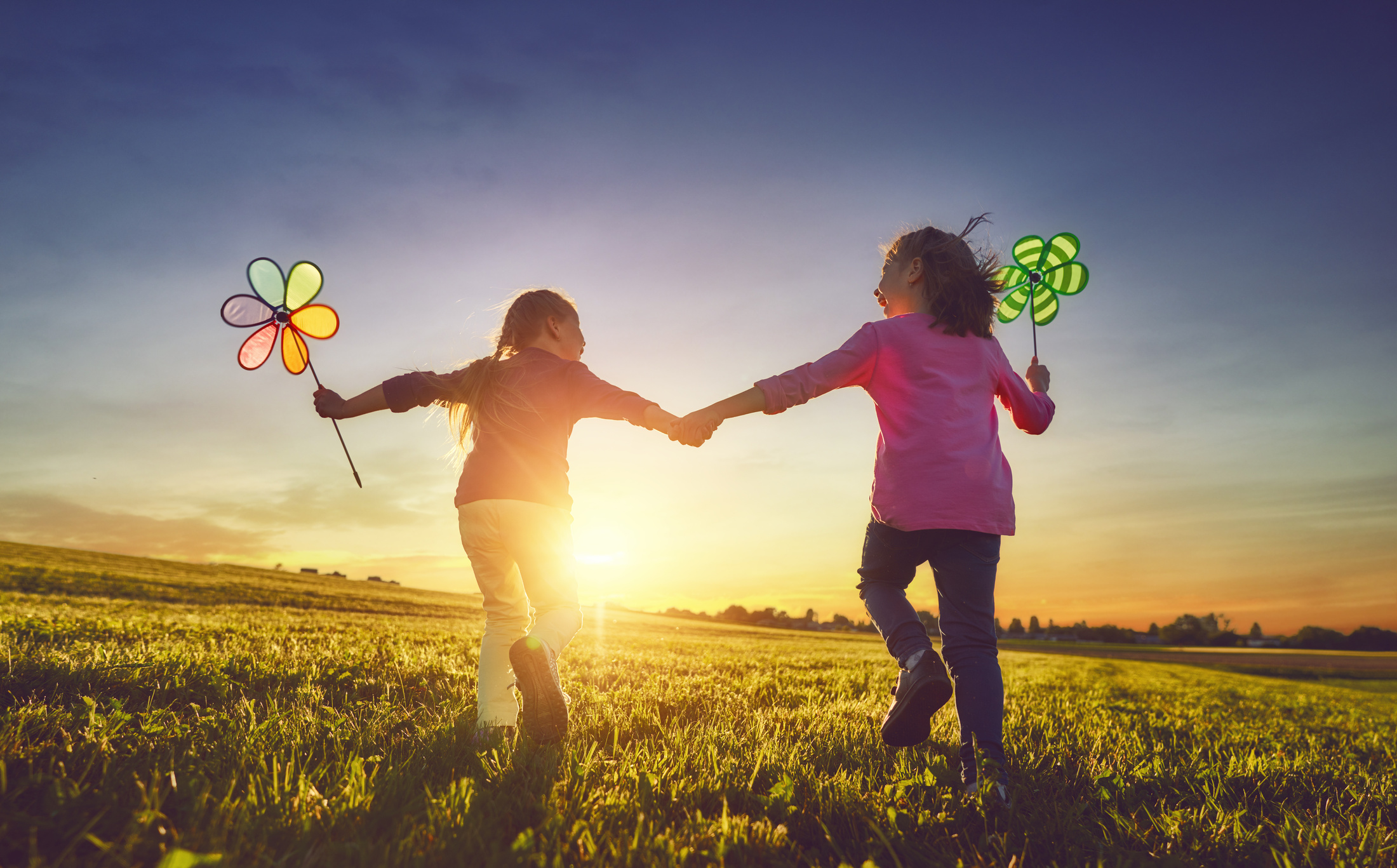 Children are playing on meadow